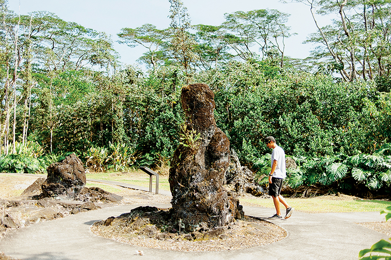  /><figcaption>A lava mold of a former tree at the Lava Tree State Monument.<br />
Photo: Megan Spelman</figcaption></figure>
</div>
<p>Entire towns have been destroyed by lava in Puna, with names you may recognize: Kapoho in 1960, Kalapana in 1986, and Kaimu in 1990. More recently, in 2014, Kaohe Homesteads and Pahoa were threatened by a lava flow from the east rift zone of Kilauea volcano before it stalled and stopped.</p>
<p>Destructive lava flows are a real concern for the people in this district, prompting some local residents to move out and other more temporary residents to move in. Given the land’s volatile nature and low cost of living, the large number of transplants and hippies living in the area shouldn’t have surprised me when I arrived, but it did. It’s unlike any other place in Hawaii I’ve been to, not only because of the makeup of its people, but also because of its isolation and contrasting scenery.</p>
<p>After waking in my jungle abode to the rising sun, I decide to take the car out and explore Puna for the day, excited to be surrounded by people again and to be visiting places where there are real bathrooms. My first stop is the Lava Tree State Monument for a quick walk around the grounds, where molds of tree trunks formed by lava can still be seen from its late-18th-century flow.</p>
<div style=