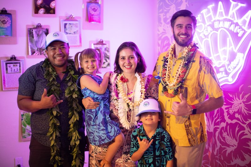  /><figcaption>From left: Mosese Ohia, Shaka Tea retail experience manager and founders Bella Hughes and Harrison Rice<br />
with their kids, Roya and Koa Rice, on the day the shop opened on July 2.<br />
<em>Photo: Courtesy of Ekahi Media</em></figcaption></figure>
</div>
<p>Fast forward three years and Shaka Tea is found in more than 2,000 locations in the U.S., the company has relocated to Hawaii Island (where all of its mamaki is grown), its product line has expanded to include tea blends and new flavors, and, just this week, the couple opened its first retail space in Hilo.</p>
<p>I’d say that’s making it.</p>
<p>The new shop is called Shaka Tea HQ & Retail Experience Center and it’s located between two iconic Hilo foodie destinations on Kilauea Avenue fronting Hilo Bay: Two Ladies Kitchen, with its cult-popular mochi (Japanese rice cakes) and Asami’s Kitchen, an old-school okazuya popular for its boneless fried chicken. The couple couldn’t have asked for a better location.</p>
<p><strong>SEE ALSO: <a href=