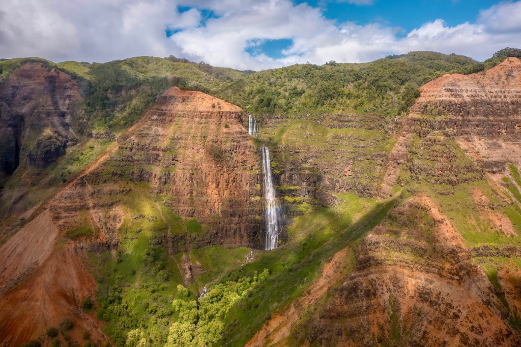Wide Angle View Of The Beautiful Waipo'o Falls In Waimea Canyon State Park, Kauai, Hawaii, Shot From A Helicopter.