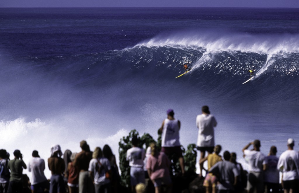 Surfers On North Shore Of Waimea Bay, Hawaii Oahu, Usa