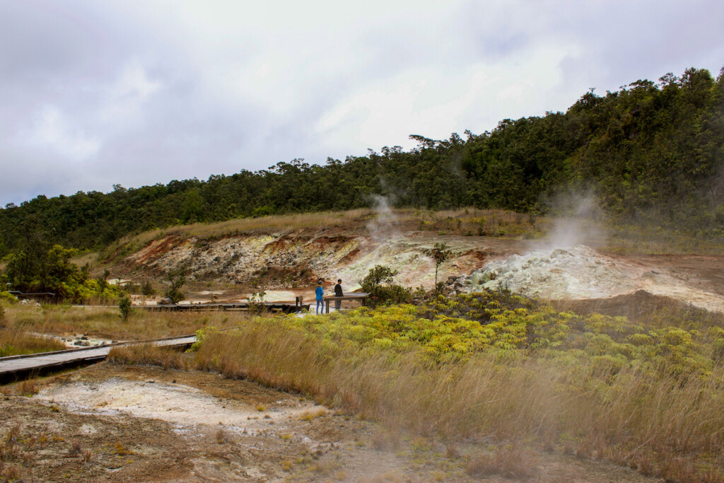 Tourists View The Sulphur Banks That Can Be Found Walking Along The Boardwalk In Volcanoes National Park