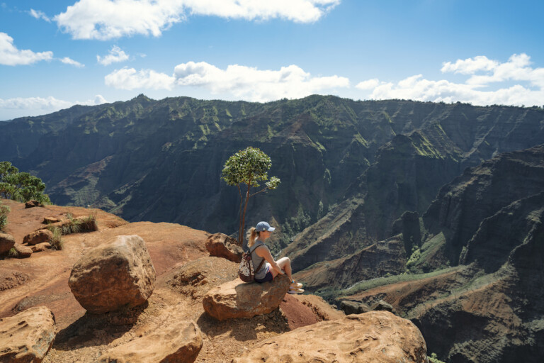 Woman On Waipo'o Falls Via Pu'u Hinahhina And Canyon Trail Koke'e State Park Kauai Hawaii Usa